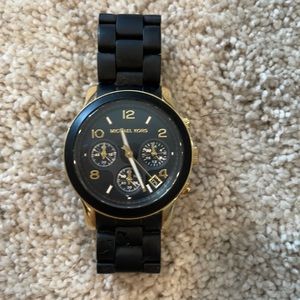 Black and gold Michael Kors watch